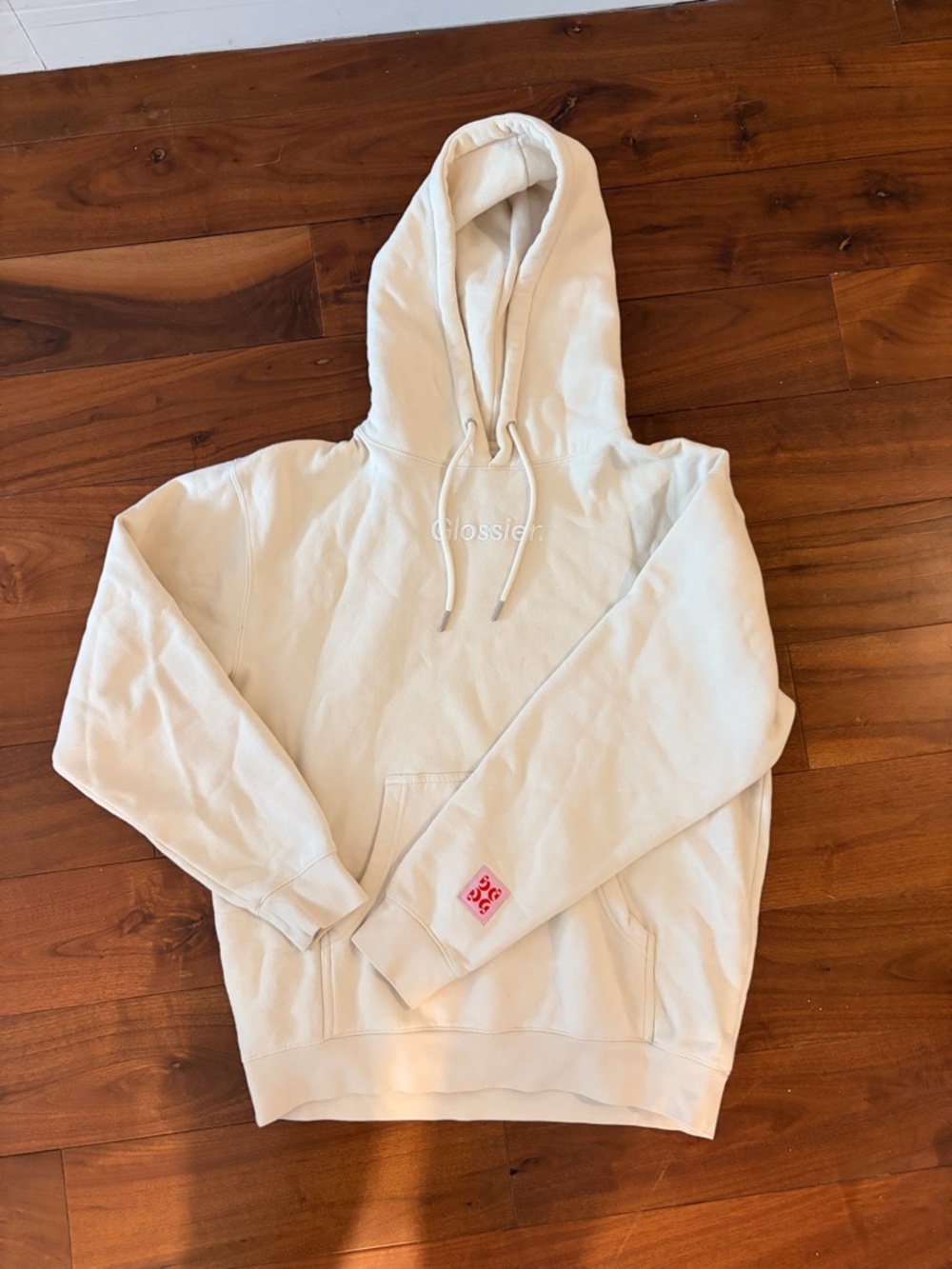 Glossier Cream Hoodie with Pink Patch